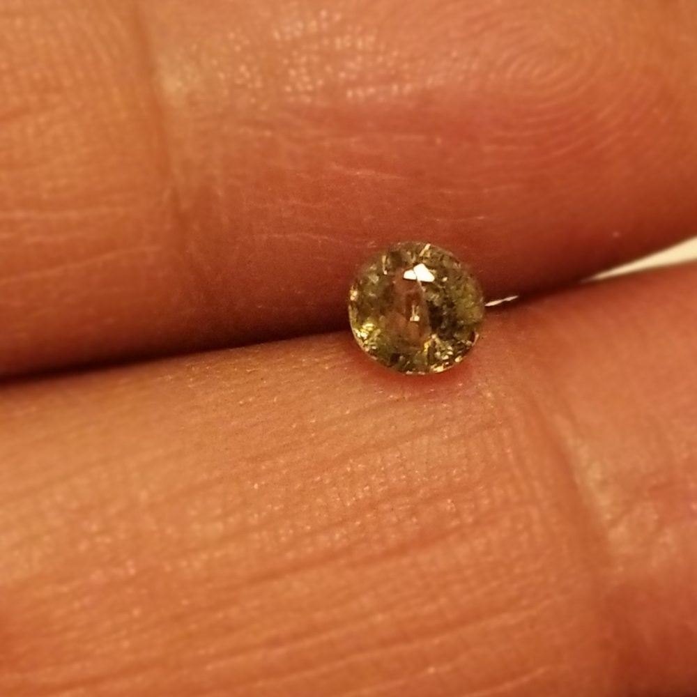 Demantoid garnet  horsetail inclusions  .55 carats